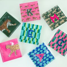 six different animal themed paper napkins on a table with the letter k in them