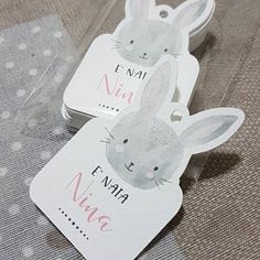 two tags that say i'm not nig and have rabbits on them