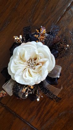 a white flower with black and gold accents