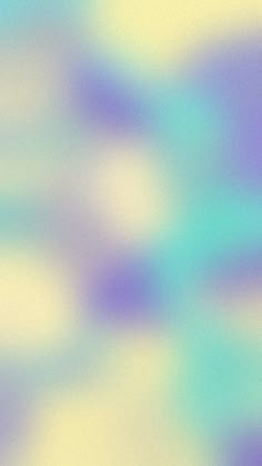 an abstract blurry background with blue and yellow colors in shades of purple, pink, green and white