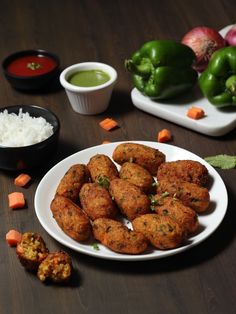 some food is on a white plate with sauces and vegetables in bowls around it