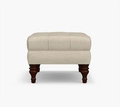 the footstool is made out of wood and has a beige upholstered fabric