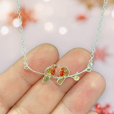 A beautiful, delicate, sterling silver Robin necklace. The necklace features two Robins sitting on a branch. The sterling silver necklace is 18 inches in length in total. The Robins feature tiny encase real pressed Queen Anne's Lace flowers. The tiny flowers are positioned to give the Robins their colour.  The Robins and branch measure 35mm in length. The chain is Eco silver meaning that it is made from predominately recycled, rather than mined, silver.  Your jewellery will also arrive with a sm Sterling Silver Necklaces With Pressed Flowers, Silver Sterling Silver Necklace With Pressed Flowers, Rowan Berry Necklace, Robin Ornament, Robin Mug, Silver Meaning, Robin Necklace, The Robins, Silver Bird Design Pendant Necklace