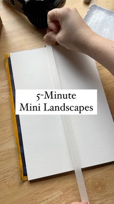 someone is holding a piece of paper with the words 5 - minute mini landscapes