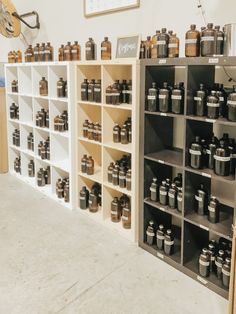 the shelves are filled with many different types of jars