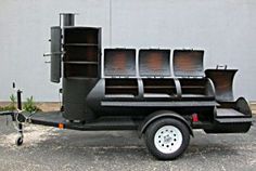 a black truck with lots of drawers on the back and side shelves in the rear