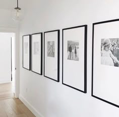 black and white photographs hanging on the wall