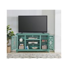 a flat screen tv sitting on top of a green entertainment center