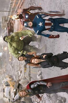 the avengers are standing in front of each other