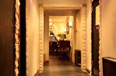 an empty hallway leading to a dining room