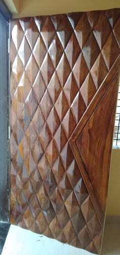 a wooden door with diamond design on it