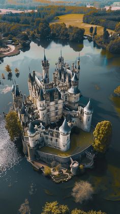 an aerial view of a castle in the water