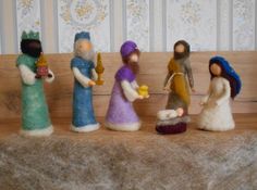 a group of figurines sitting on top of a table