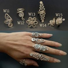 a woman's hand with several rings on it and the numbers in different styles