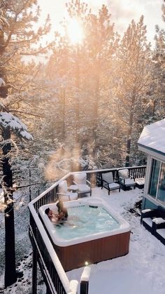 a hot tub sitting on top of a snow covered hillside