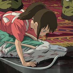 an anime scene with a woman on the ground