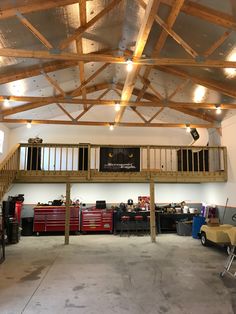 the inside of a garage with lots of work on the walls and ceiling, along with various tools