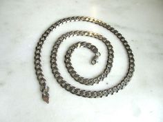 This is a mens vintage heavy, thick solid sterling silver chain necklace.  The flat curb chain is 29 1/2" long x 9mm wide.  It has a secure lobster clasp marked ITALY 925.  Total weight of the chain is 99.3 grams. This is a vintage, previously owned chain.  Therefore, light wear can be expected.  There is no visible damage. Chain Necklace Men, Vintage Chain Necklace, Curb Chain Necklace, Vintage Chain, Necklace Men, Sterling Silver Chain Necklace, Sterling Silver Mens, Mens Vintage, Curb Chain