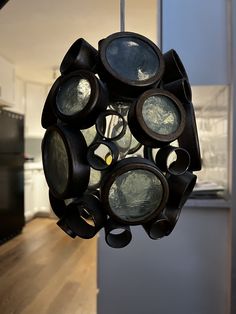 a circular object hanging from the ceiling in a kitchen