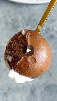 an ice cream sundae with chocolate frosting and sprinkles on it