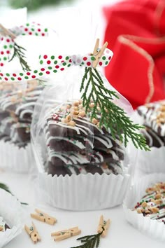 chocolates wrapped in cellophane and sprinkled with christmas decorations are on display