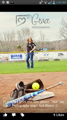 a woman standing on top of a baseball field next to a bat and ball in the dirt