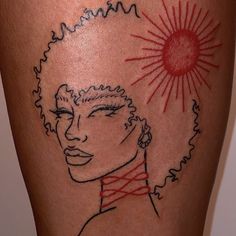 a woman's tattoo with a sun behind her head