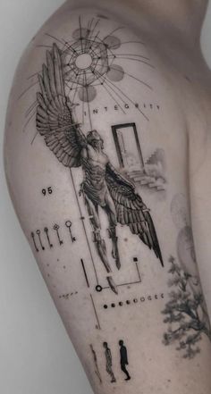 the back of a man's shoulder with an angel and geometric design on it