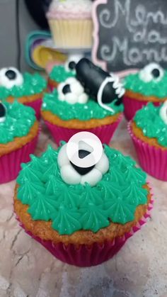 cupcakes decorated with green frosting and black eyes