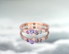 two rings with different colored stones on them