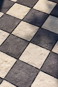 a black and white checkered floor with a red fire hydrant