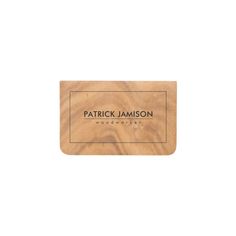 a wooden business card with the name patrick jameson on it