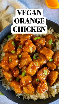 a bowl filled with orange chicken and rice next to an orange slice on the side