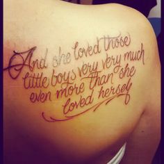 the back of a woman's shoulder with words written in cursive writing