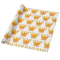 a yellow crown pattern wrapping paper on a white background with orange and red stripes in the middle