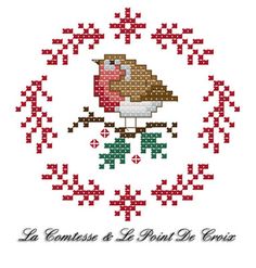 a cross stitch pattern with a bird on it