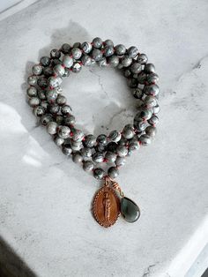 Mala Necklace with Brass Thai Buddha Pendant, Picture Jasper Beads, and a Gray Crystal charm | Meditative Necklace | Boho Necklace Hand knotted Red Waxed Cotton Cord Thai Buddha, Buddha Pendant, Mala Necklace, Picture Jasper, Necklace Boho, Jasper Beads, Crystal Charm, Natural Beads, Boho Necklace