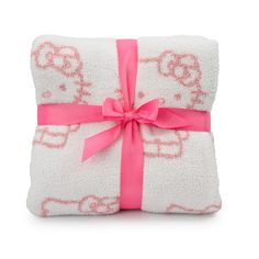 two towels wrapped in pink and white with a bow on the front one has hello kitty written on it