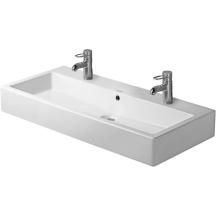 a white sink with two faucets on the top and one faucet