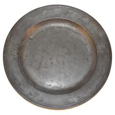 an old metal plate on a white background