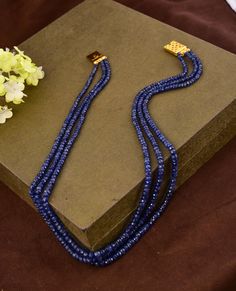 Natural Genuine Blue Sapphire Beaded Necklace NW : 250 carats GW : 265 carats No. Of Layers : 3 1 gm 18k Gold Clasp Set in Sterling Silver 925 Model Image Necklace Length : 20 Inches Non-Tarnishable Skin Tested 18k Gold Plated Clasp To Avoid Any Tarnishing Provided with GRS Lab Certification Real Time Image. No Tampering Please note all the gemstones we use at RiyaJewels are completely Natural , Unheated And Non-Treated. Riya Jewels Has Set New Standards In Contemporary Silver Jewelry. In Each N Luxury Blue Gemstone Beads Jewelry, Luxury Blue Beaded Necklace With Gemstone Beads, Luxury Sapphire Jewelry With Gemstone Beads, Elegant Blue Polished Beads, Luxury Blue Single Strand Jewelry, Luxury Rondelle Gemstone Beaded Necklaces, Luxury Beaded Necklace With Polished Rondelle Beads, Luxury Rondelle Gemstone Beaded Necklace, Luxury Rondelle Gemstone Beads Necklace