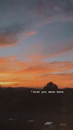 a sunset with the words wish you were here