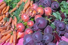 carrots, radishes and beets are on display