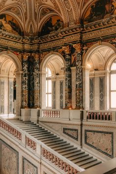 an ornate building with many windows and stairs