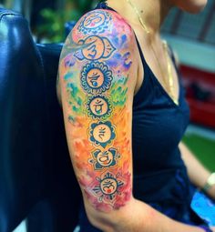 a woman with a colorful tattoo on her arm