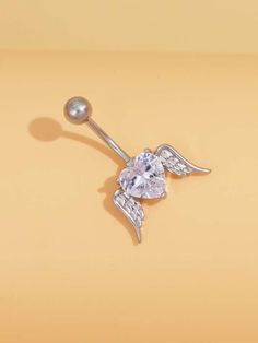 an angel belly ring with crystal stones on it's side and wings attached to the end