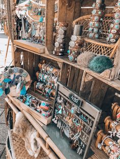 an outdoor market with lots of jewelry on display