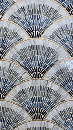 an art deco tile pattern in blue and gold