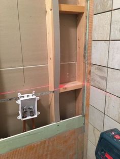 an electrical outlet is being installed in the corner of a room that's under construction