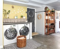 a washer and dryer sitting in a room next to a shelf filled with plants